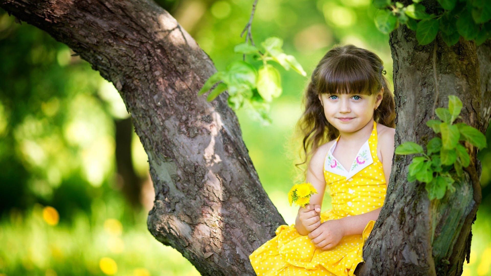 Cute baby girl in yellow dress