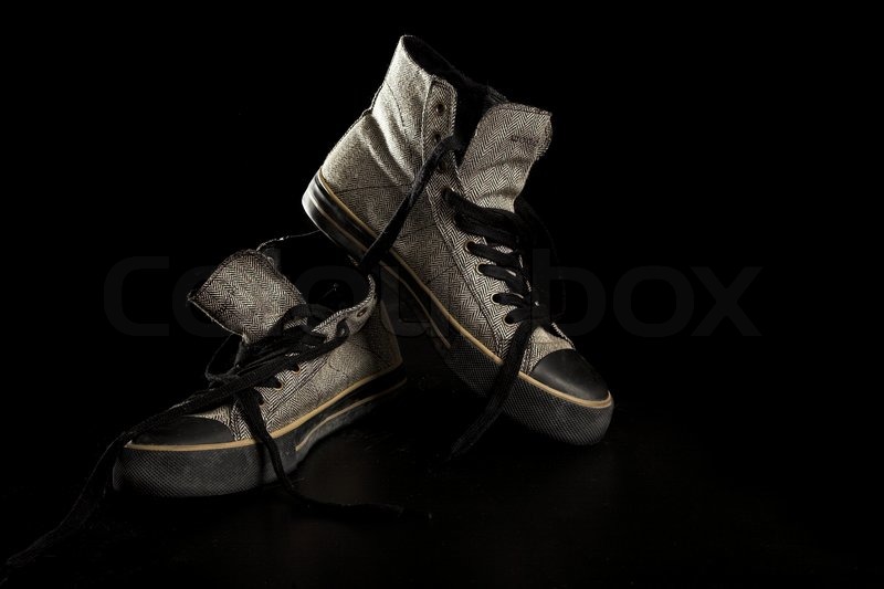 Pair gym shoes isolated on the black background Stock Photo