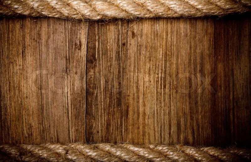 Rope on weathered wood background Stock Photo Colourbox