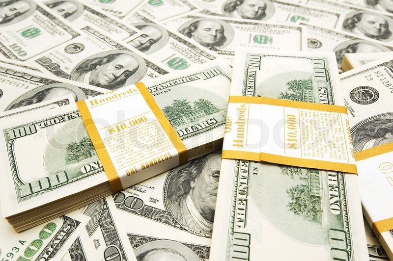 Ten thousand dollar stacks on money background Stock Photo
