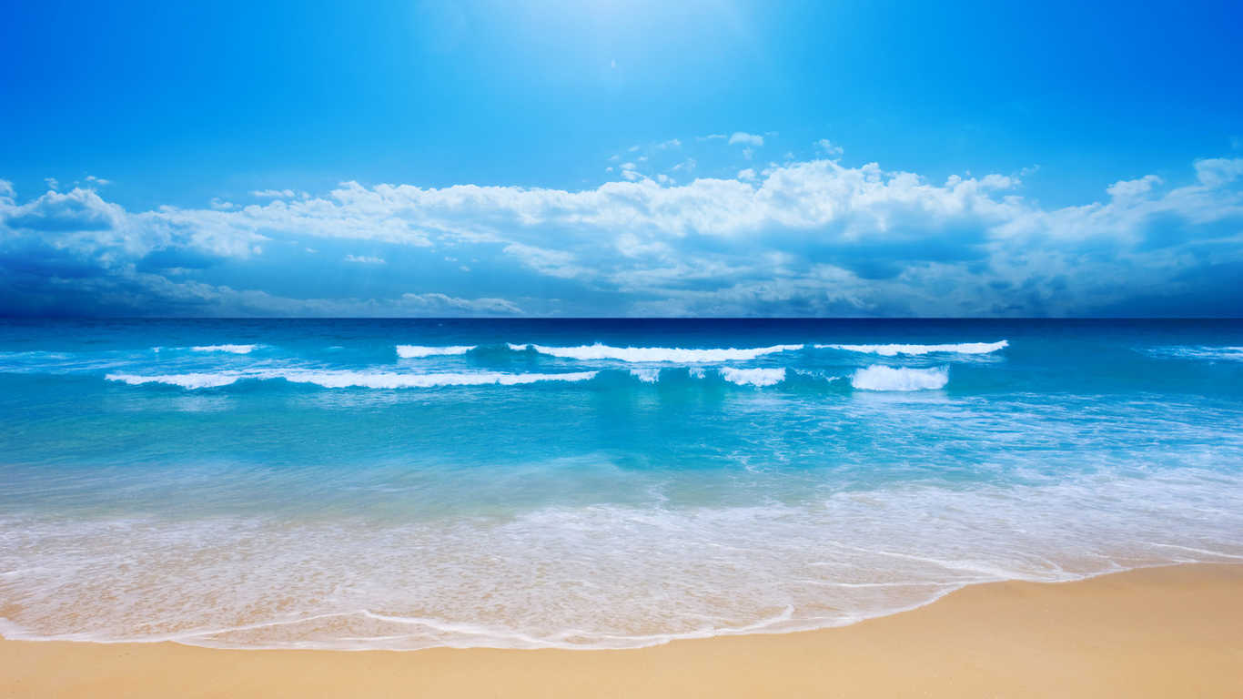 Summer time small waves on the beach 1366x768