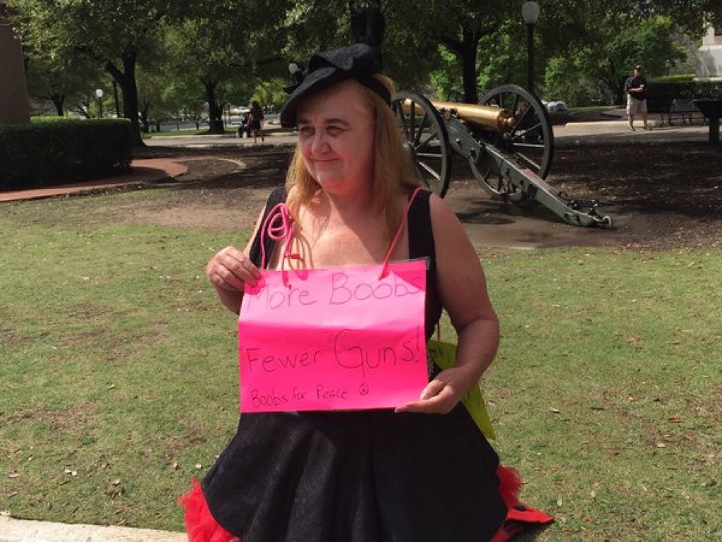Topless woman takes on open carry supporters in Austin - Houston