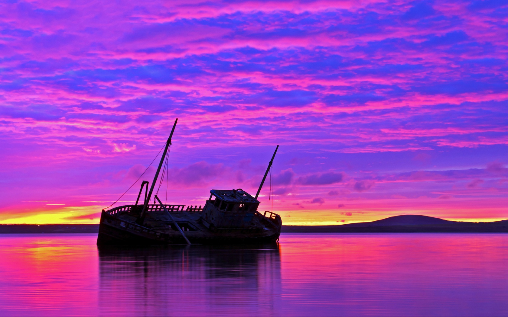 1680x1050 Shipwreck purple sunset Wallpaper