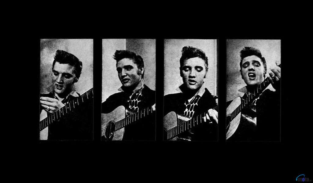 Download Wallpaper Elvis Presley plays a guitar 1024 x 600