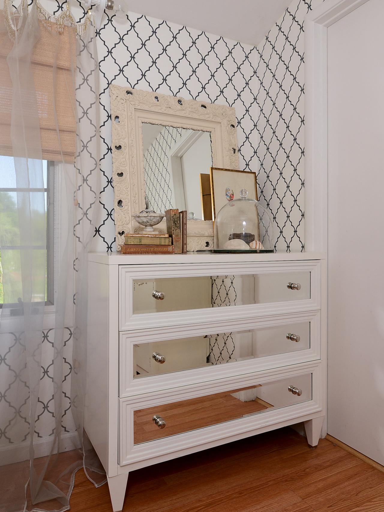 Trellis Wallpaper and Mirrored Dresser in Cottage-Style Bedroom | HGTV