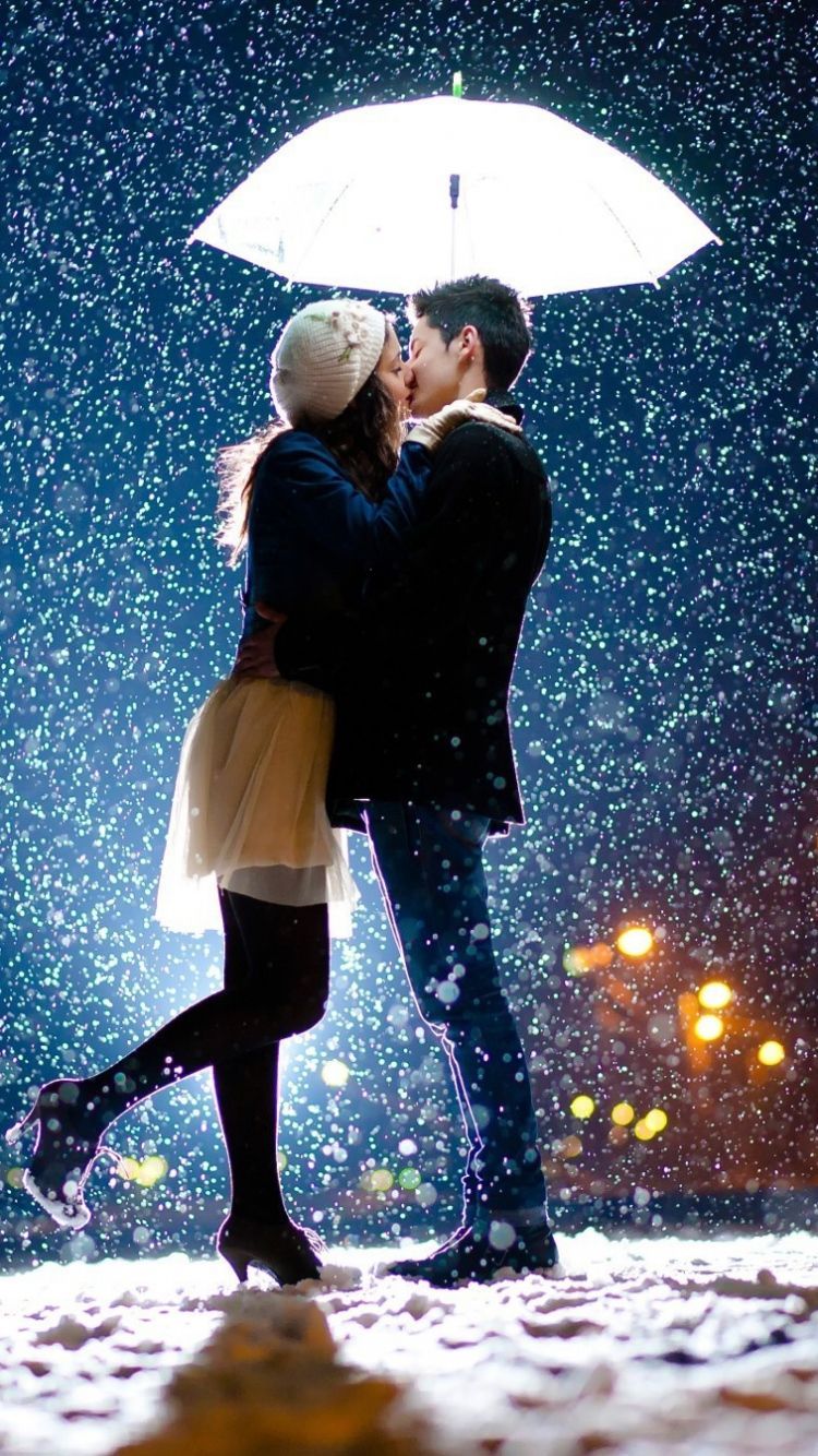 Download Wallpaper 750x1334 Couple, Love, Kiss, Snow, Umbrella