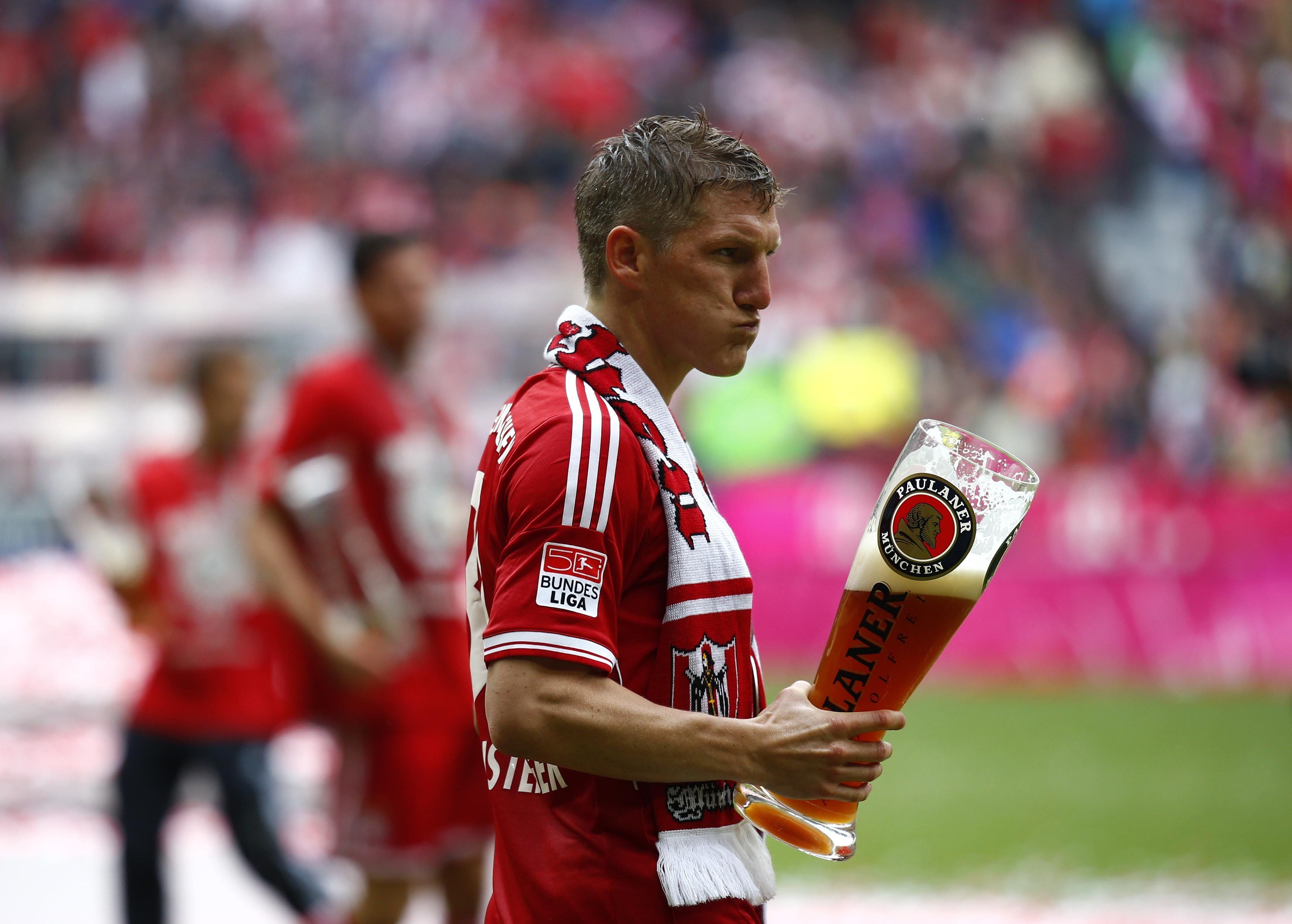 The player of Bayern Bastian Schweinsteiger with a beer wallpapers ...