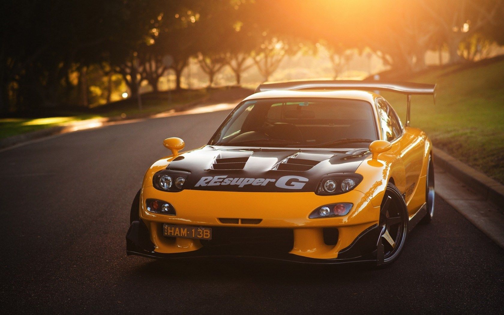 yellow car mazda rx 7 on landscape of tree under sunset hd 1080p