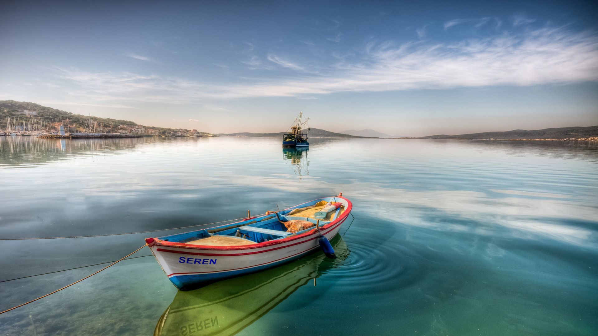 boat-tied-up-in-a-peaceful-harbor-hd-wallpapers.jpg