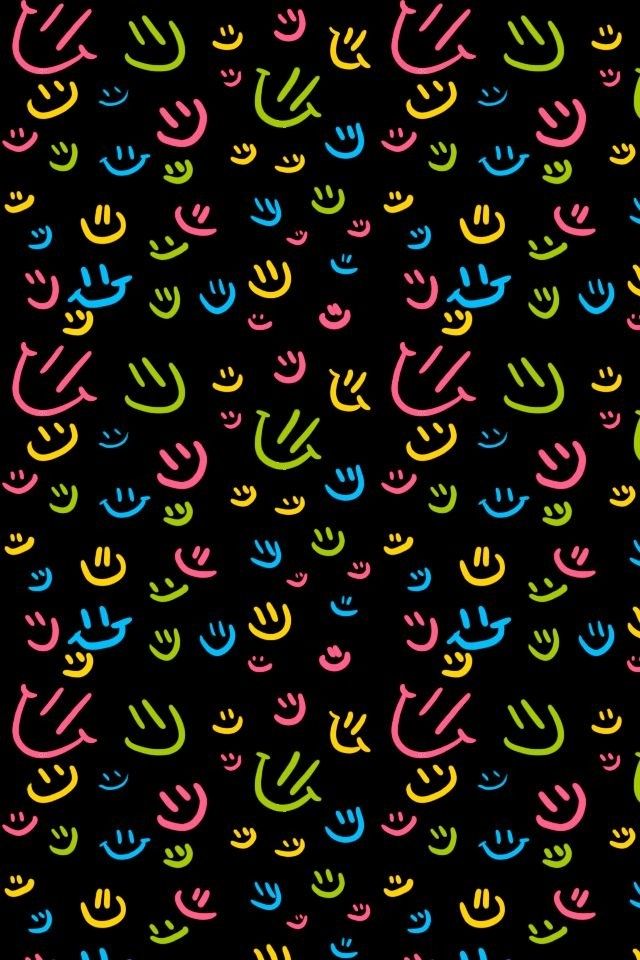 Pink, Yellow, Blue, and Green Smiley faces on a Black background