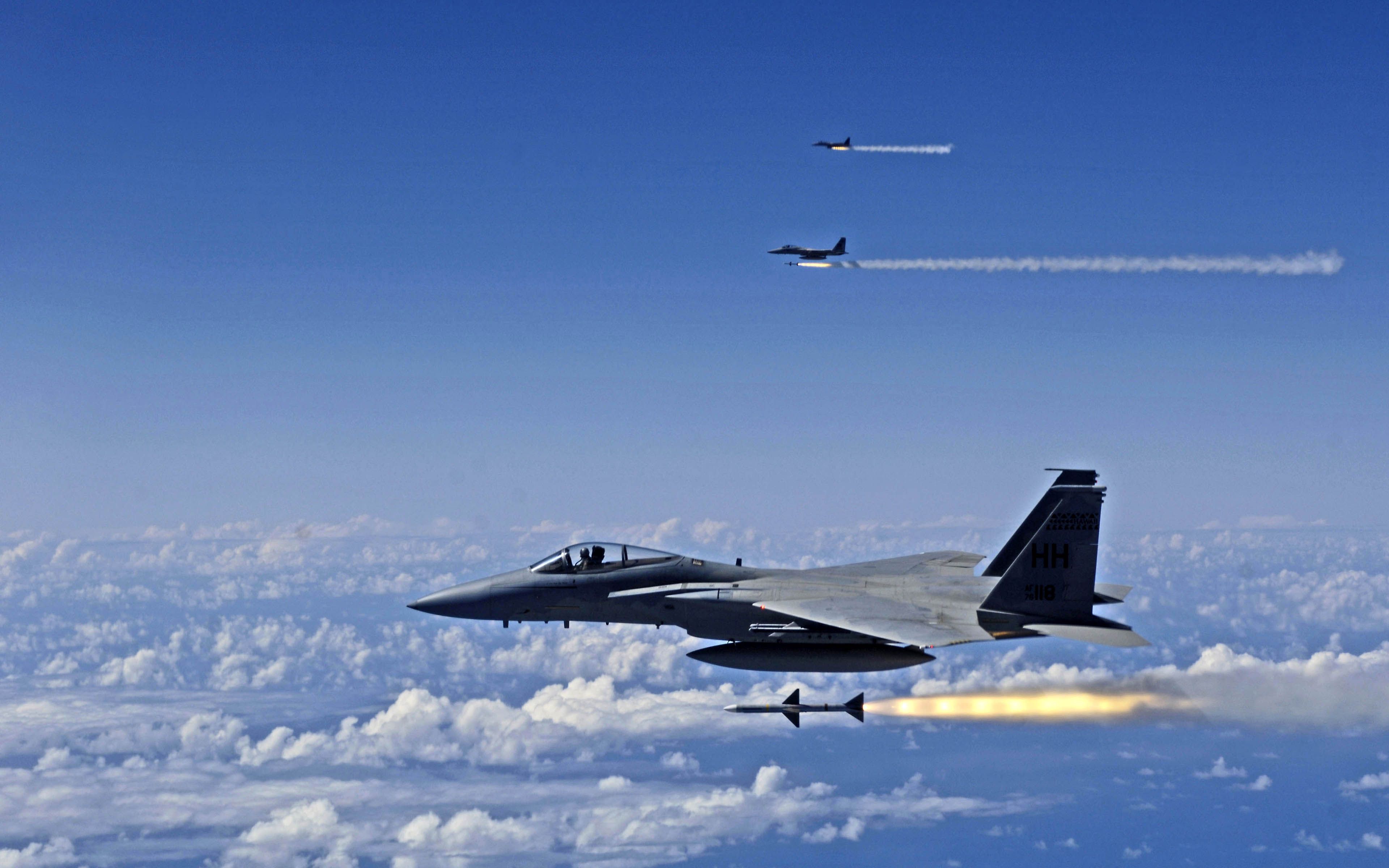 McDonnell Douglas F-15 Eagle fire AIM-7 Sparrow missiles at a ...