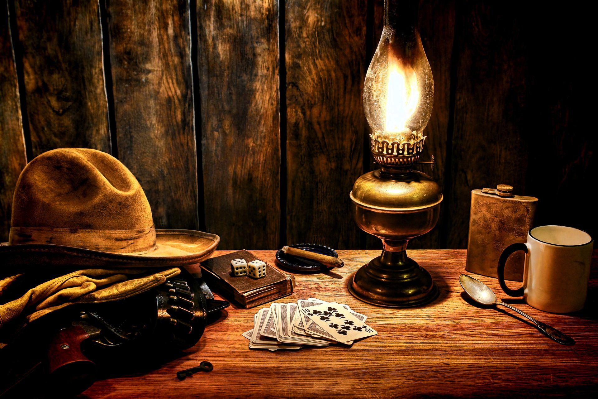 Table surface cowboy hat gloves revolver colt bandolier wild west