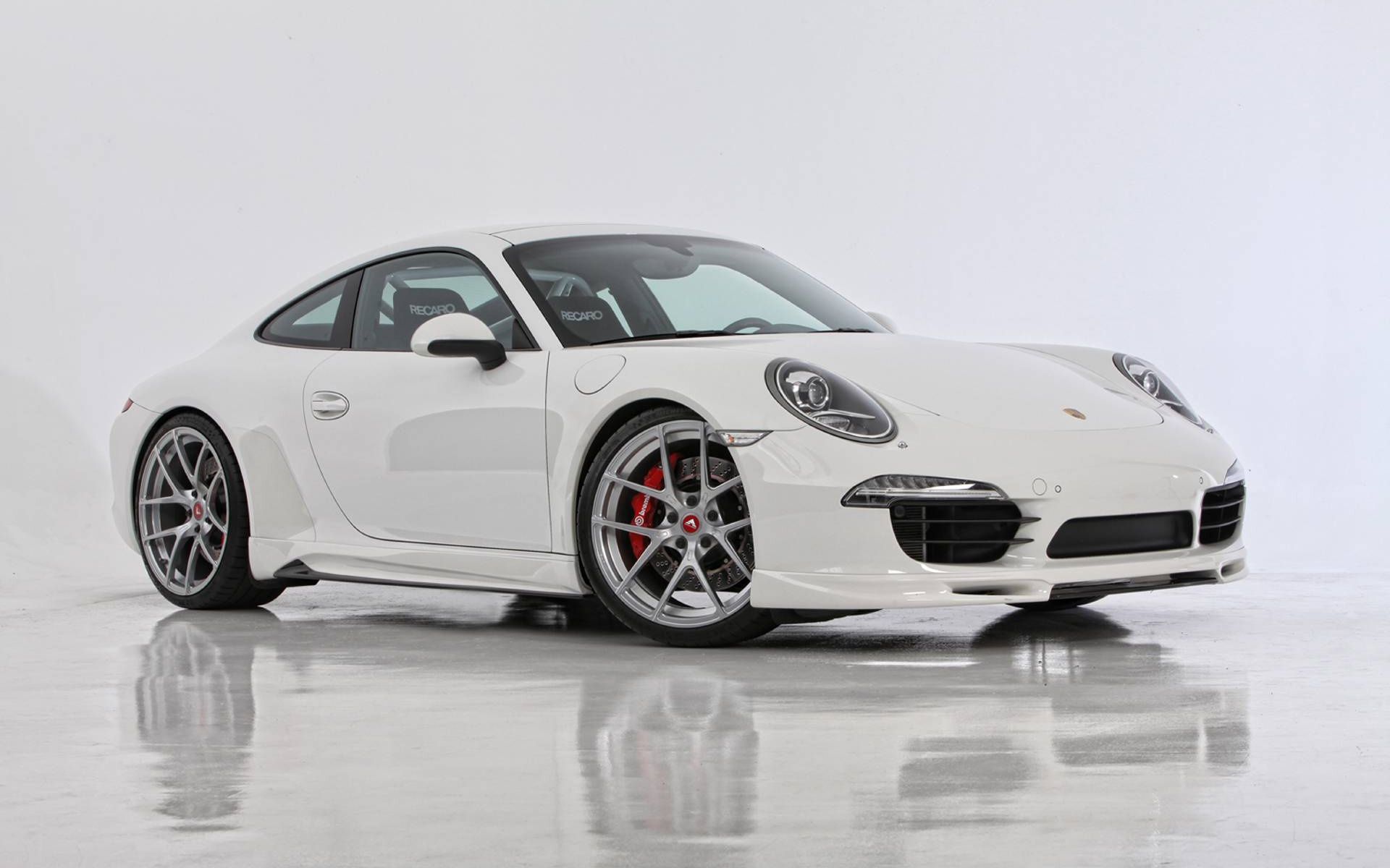 Click To Free Download The Wallpaper A White Porsche Car In Stop