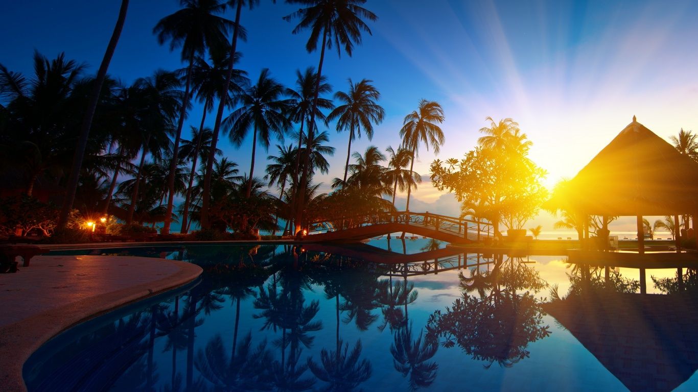 1366x768 Pool sunset resort Wallpaper