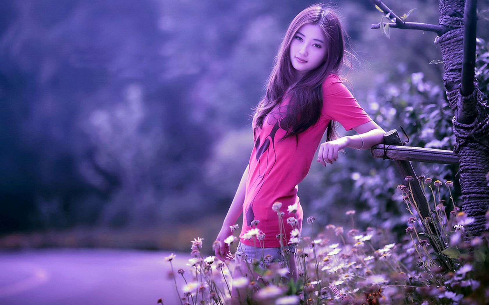 Girl in Casual Clothes and Hair Style Standing Among Flowers and other