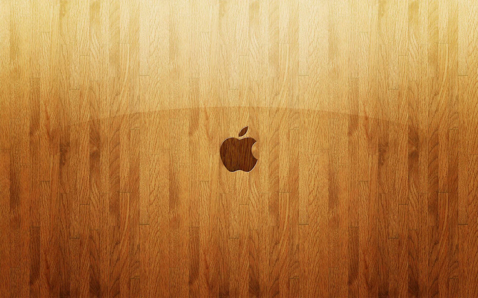 Apple on light wood desktop wallpaper 1384