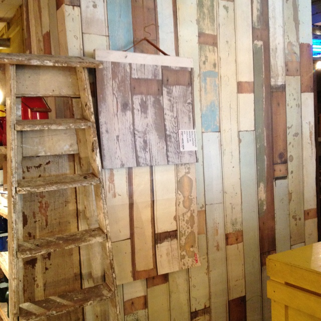 Fun wallpaper that looks like battered old planks of wood