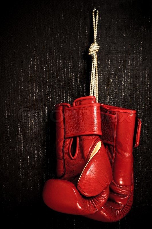 Boxing-glove hanging on grunge background | Stock Photo | Colourbox